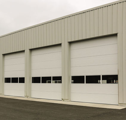 M2K熱絶縁材が付いている倉庫1.0を滑らせる商業鋼鉄頭上式の部門別のドアの上昇